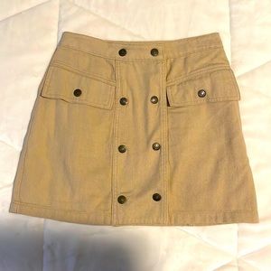 Tan cute mini skirt.